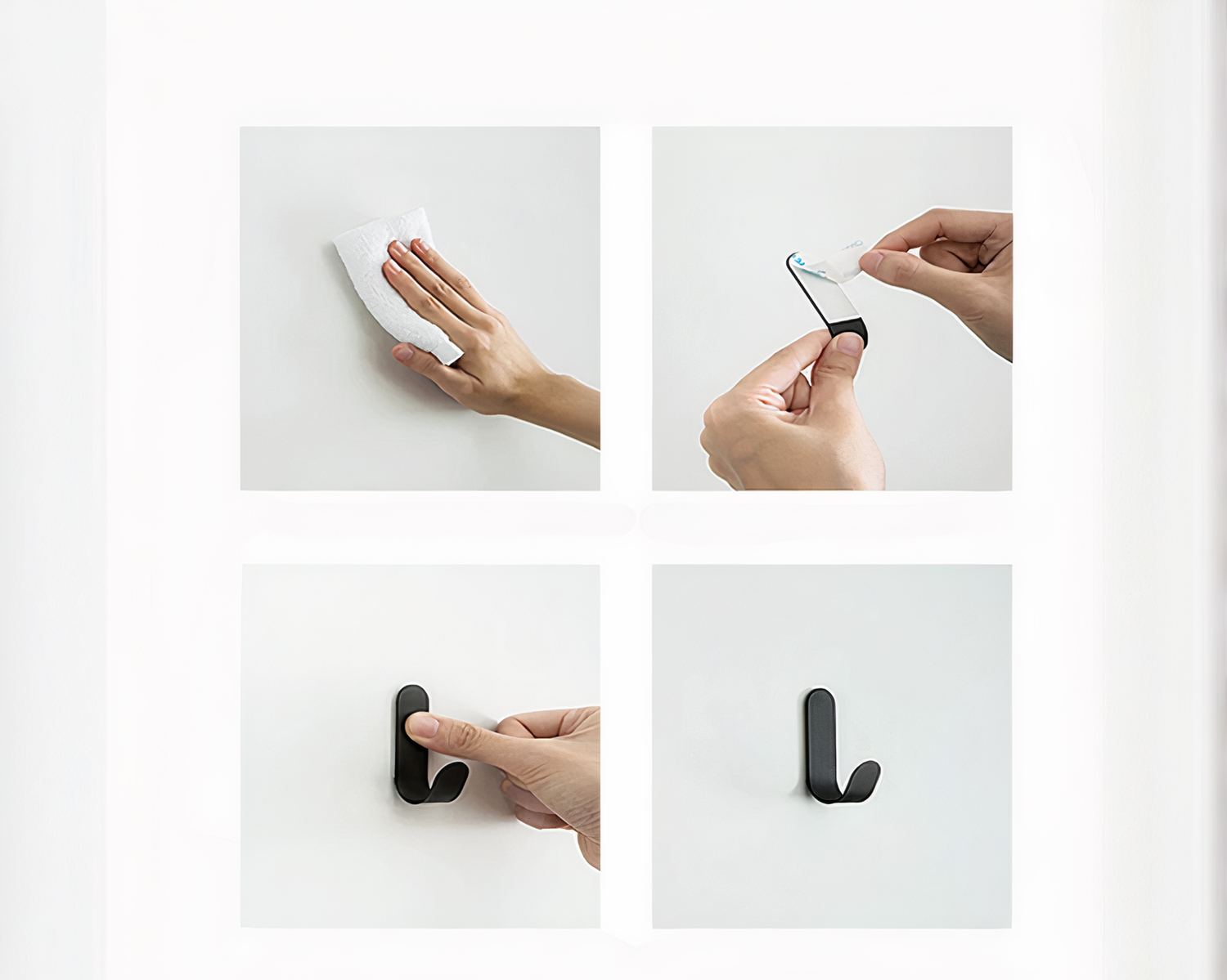 Crochets adhésifs noirs sur un mur.