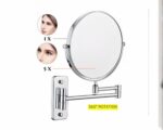 Miroir grossissant dépliant sur fond blanc.