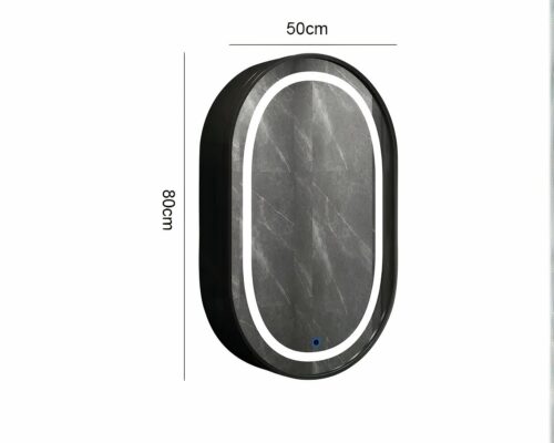 Miroir ovale sur un mur gris.