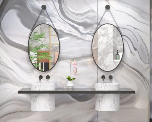 Miroirs ovales suspendus au-dessus de deux vasques.