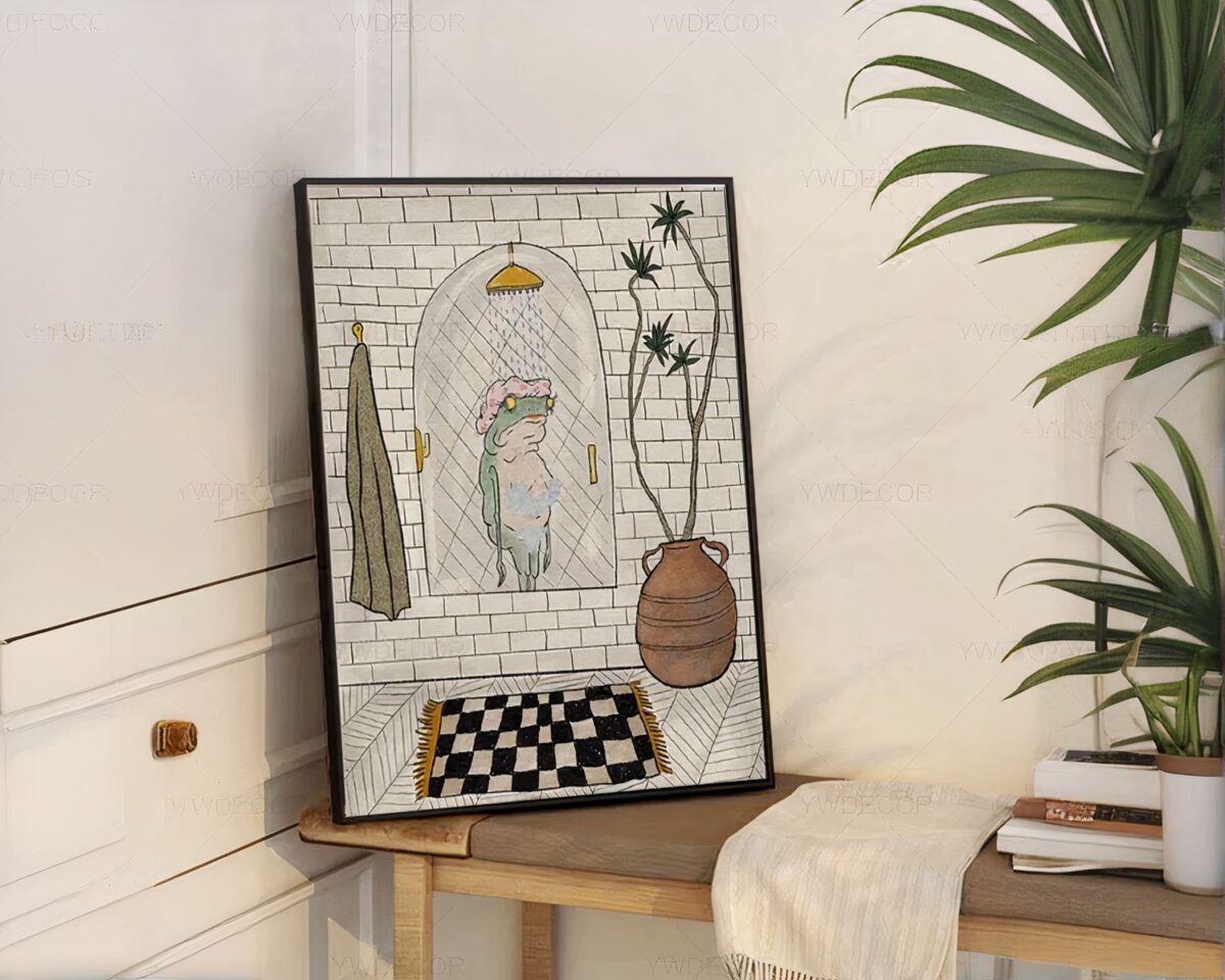 Tableau avec une grenouille sous la douche posé sur un banc en bois.